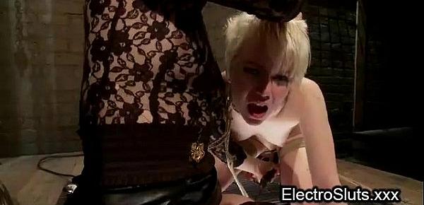  Pale brunette babe bound in swing fucked with electro strapon